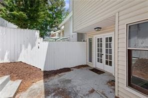 4406 Idlewood Ln, Tucker, GA 30084 - view of patio / terrace featuring fence and french doors