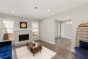 4406 Idlewood Ln, Tucker, GA 30084 - living area with healthy amount of natural light, wood finished floors, baseboards, a fireplace, and recessed lighting