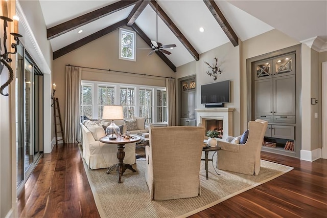 living area with high vaulted ceiling, a fireplace, baseboards, dark wood-style floors, and beamed ceiling