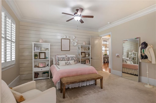 bedroom with baseboards, carpet floors, and crown molding