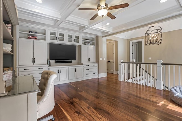 home office with beam ceiling, dark wood-type flooring, coffered ceiling, baseboards, and ceiling fan with notable chandelier