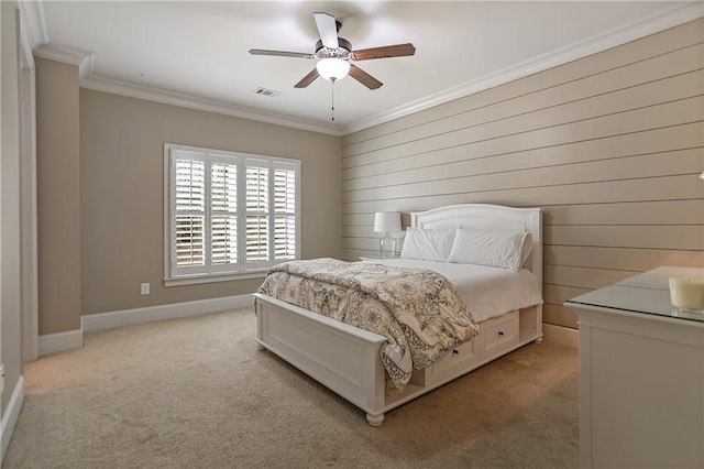 bedroom featuring baseboards, visible vents, light colored carpet, ceiling fan, and crown molding