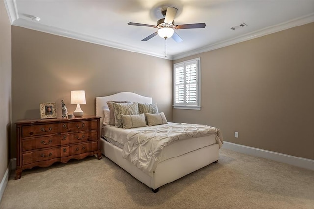 bedroom with visible vents, ornamental molding, light carpet, ceiling fan, and baseboards