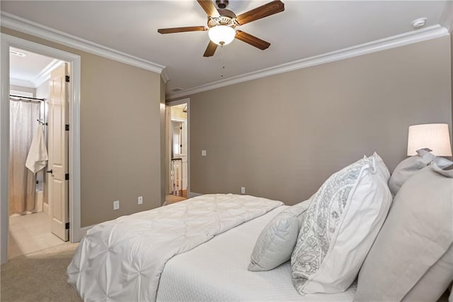 bedroom featuring carpet floors, ceiling fan, ornamental molding, and ensuite bathroom