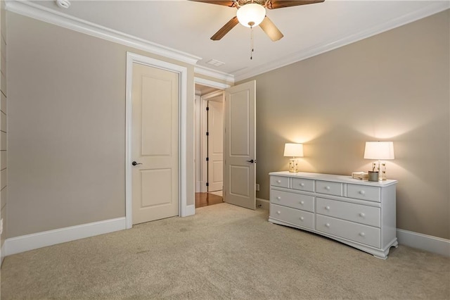 unfurnished bedroom featuring ornamental molding, light colored carpet, and baseboards