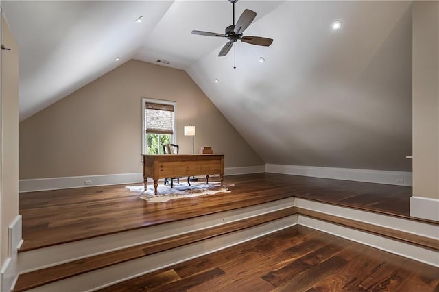 bonus room featuring a ceiling fan, lofted ceiling, baseboards, and wood finished floors