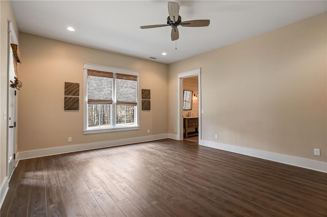 unfurnished bedroom with dark wood-type flooring, recessed lighting, connected bathroom, and baseboards