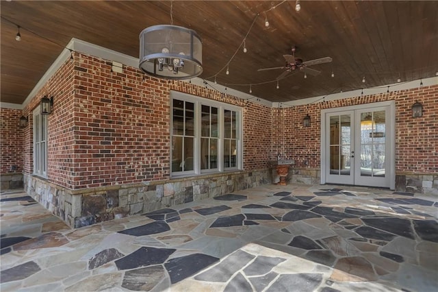 view of patio / terrace featuring a ceiling fan and french doors