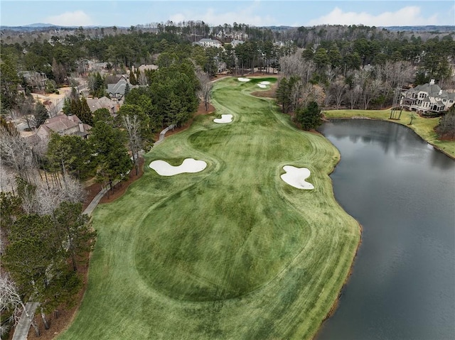 aerial view featuring view of golf course and a water view