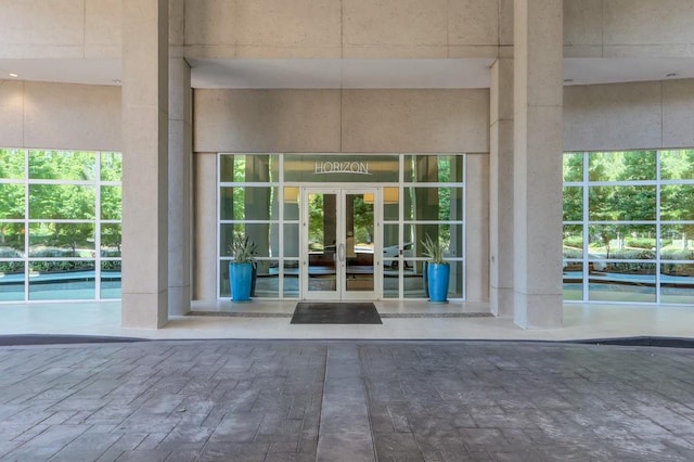 view of exterior entry featuring french doors