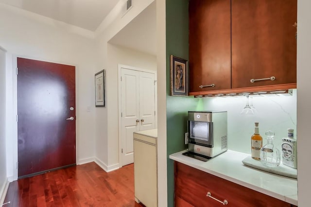 kitchen with dark wood-type flooring