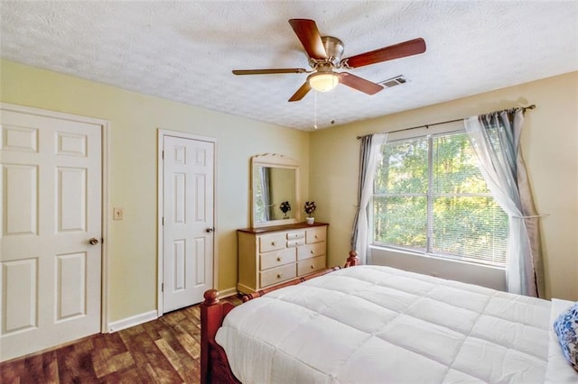 bedroom with lofted ceiling and a textured ceiling