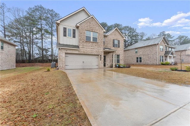 view of front of property with a garage and cooling unit