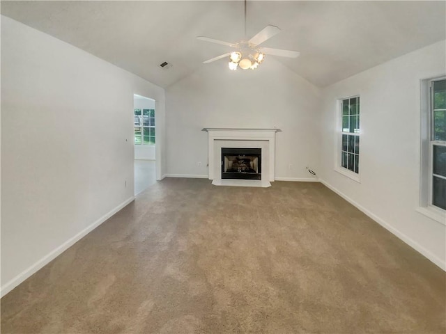 unfurnished living room featuring carpet floors, a fireplace, lofted ceiling, visible vents, and baseboards