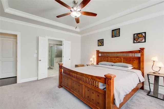 bedroom featuring baseboards, carpet, a raised ceiling, and ornamental molding