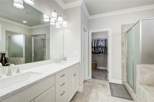 full bath featuring ornamental molding, a sink, and a stall shower
