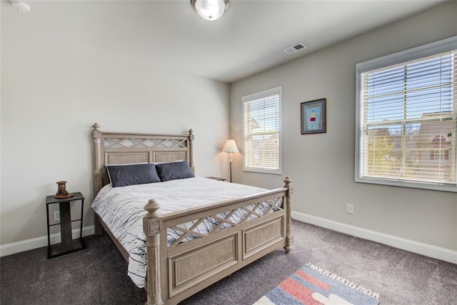 bedroom featuring carpet floors, baseboards, and visible vents