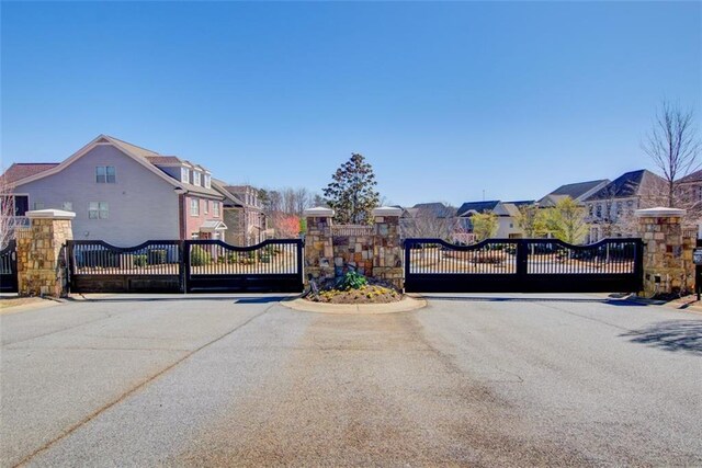 view of gate with a residential view