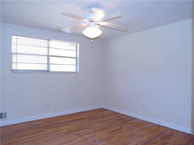 empty room with wood-type flooring and ceiling fan