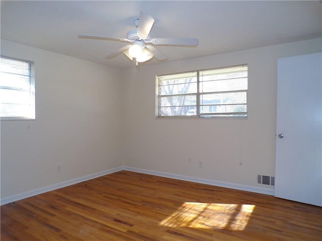 unfurnished room featuring hardwood / wood-style flooring and ceiling fan