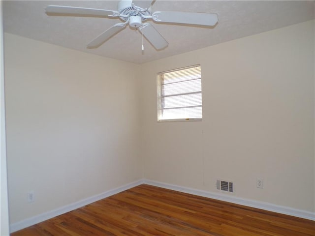 spare room with ceiling fan and hardwood / wood-style floors