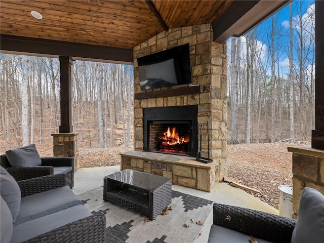 view of patio / terrace featuring an outdoor stone fireplace