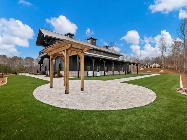 surrounding community with a patio area, a lawn, and a pergola