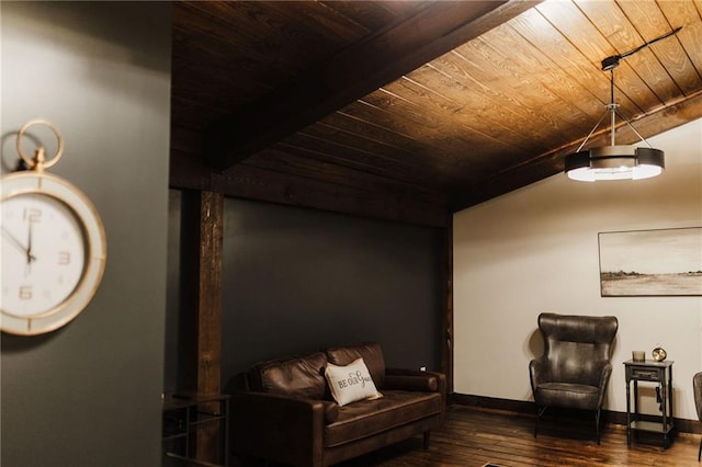 sitting room with beamed ceiling, wood ceiling, wood finished floors, and baseboards