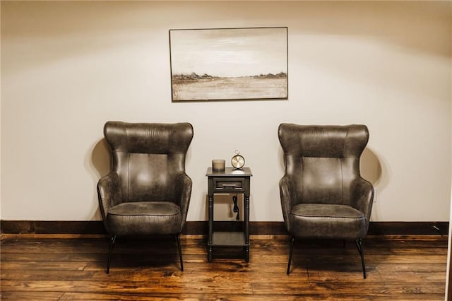 sitting room featuring hardwood / wood-style flooring and baseboards