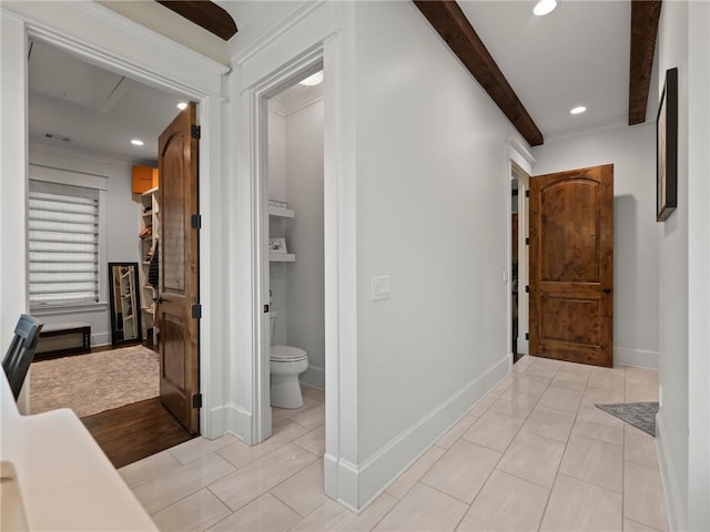 hallway with beam ceiling, light tile patterned floors, recessed lighting, and baseboards