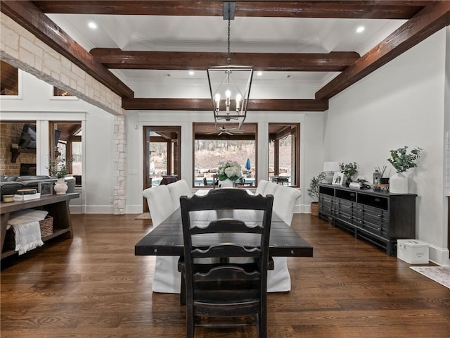 dining area featuring a notable chandelier, beam ceiling, dark wood-type flooring, and crown molding