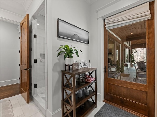 interior space featuring tile patterned floors and baseboards