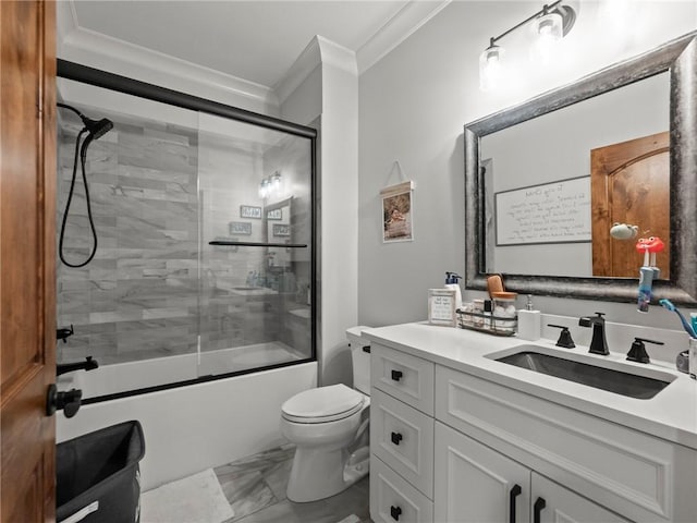 bathroom featuring toilet, marble finish floor, shower / bath combination with glass door, crown molding, and vanity