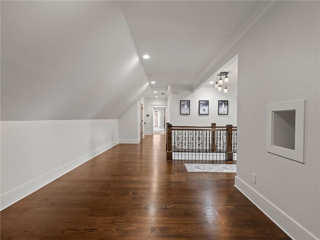 bonus room featuring recessed lighting, lofted ceiling, baseboards, and wood finished floors