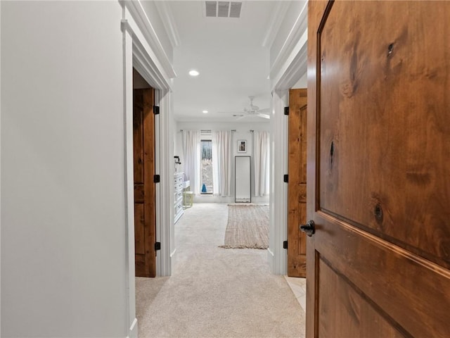 corridor featuring recessed lighting, visible vents, and light colored carpet