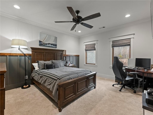 bedroom with crown molding, light colored carpet, visible vents, and baseboards