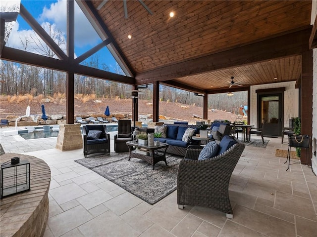 view of patio / terrace featuring outdoor lounge area, a lanai, an outdoor pool, and ceiling fan