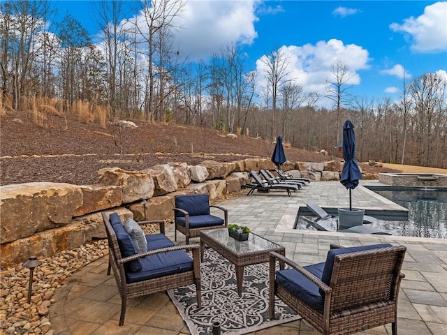 view of patio with a hot tub