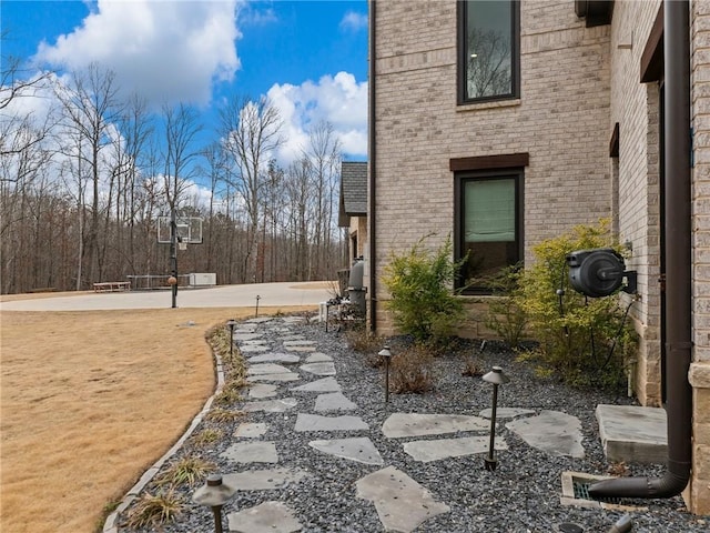 view of home's exterior with brick siding