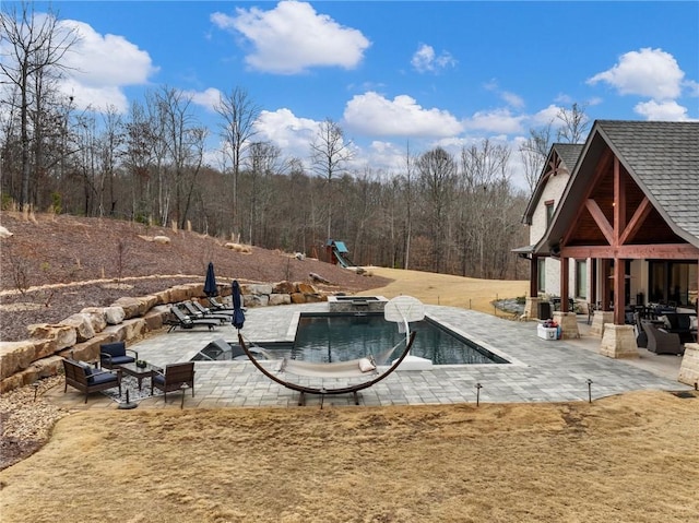 pool with a patio area