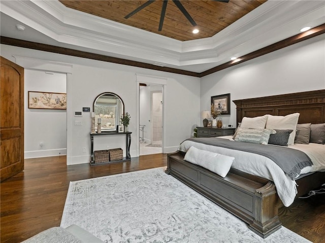 bedroom with ornamental molding, wooden ceiling, a raised ceiling, and wood finished floors