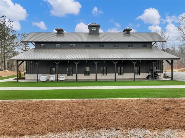 view of front of property with board and batten siding and metal roof