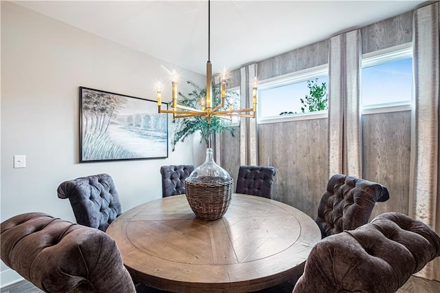 dining space featuring a notable chandelier