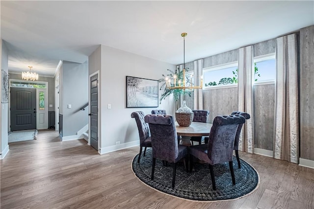 dining area with a chandelier and hardwood / wood-style floors