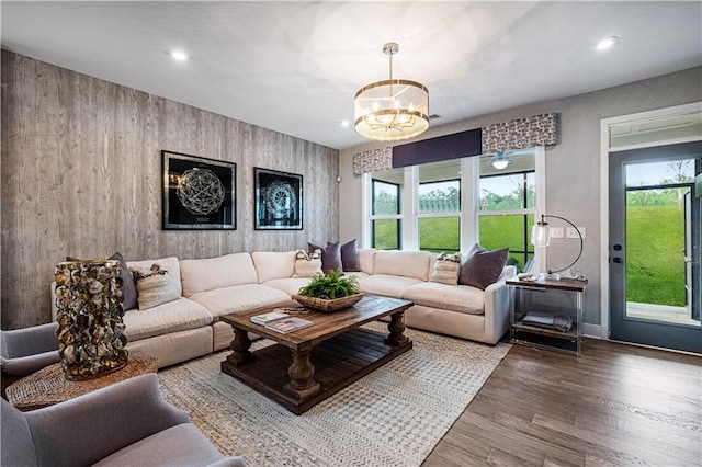 living room featuring a chandelier and hardwood / wood-style flooring