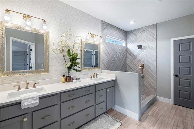 bathroom with a shower and vanity