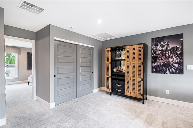 carpeted bedroom featuring a closet