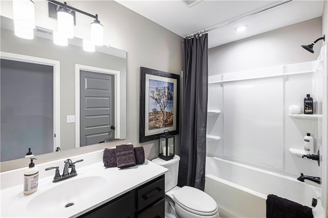 full bathroom with toilet, vanity, and shower / tub combo with curtain