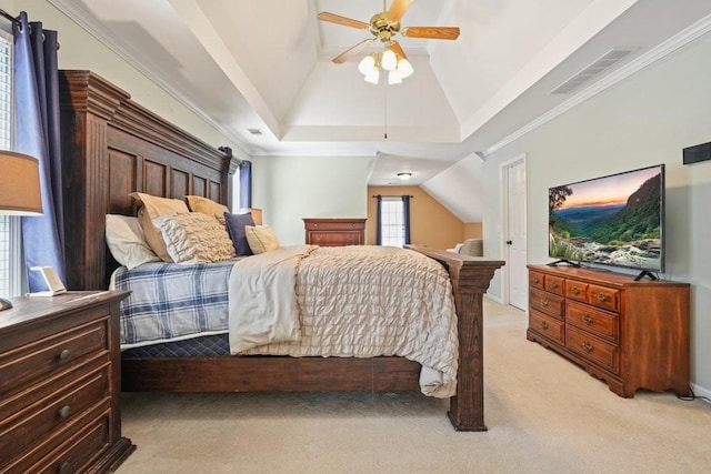 bedroom with ceiling fan, vaulted ceiling, visible vents, and light carpet