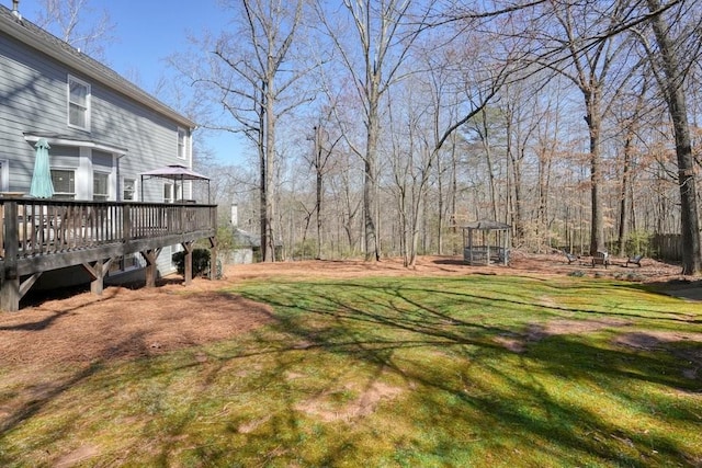 view of yard featuring a wooden deck